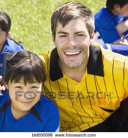 Portrait of Asian girl and soccer coach View Large Photo Image Stock Photo - Portrait of Asian girl and soccer coach. Fotosearch