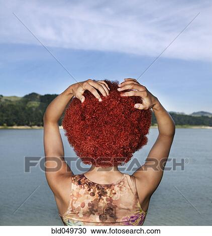 Rear view of Hispanic woman wearing wig View Large Photo Image Stock Image - Rear view of Hispanic woman wearing wig. Fotosearch