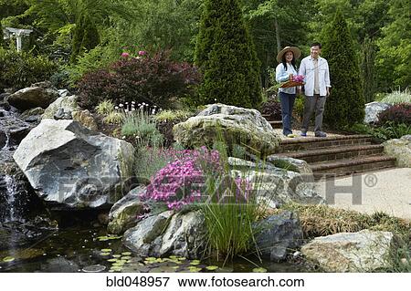 Senior Asian couple in garden View Large Photo Image Stock Photo - Senior Asian couple in garden. Fotosearch