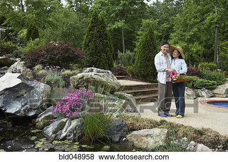 Senior Asian couple in garden View Large Photo Image Stock Photo - Senior Asian couple in garden. Fotosearch