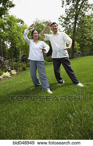 Senior Asian couple practicing tai chi View Large Photo Image Stock Photo - Senior Asian couple practicing tai chi. Fotosearch