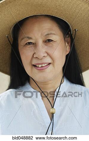 Senior Asian woman wearing hat View Large Photo Image Stock Image - Senior Asian woman wearing hat. Fotosearch