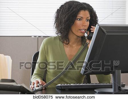 African businesswoman talking on telephone View Large Photo Image Stock Photography - African businesswoman talking on telephone. Fotosearch