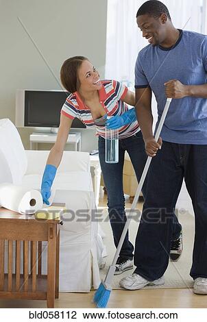 African couple cleaning house View Large Photo Image Stock Image - African couple cleaning house. Fotosearch
