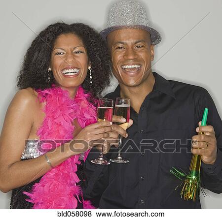 Stock Photo - African couple drinking champagne. Fotosearch