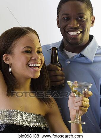 African couple drinking martini and beer View Large Photo Image Stock Photo - African couple drinking martini and beer. Fotosearch