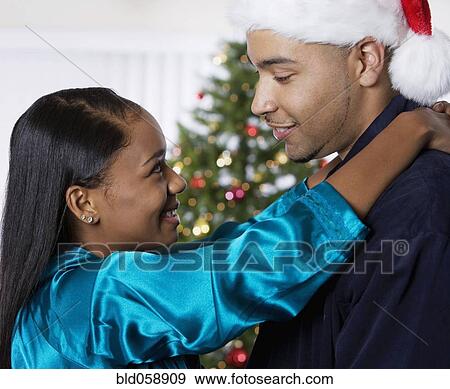 African couple hugging View Large Photo Image Stock Photo - African couple hugging. Fotosearch