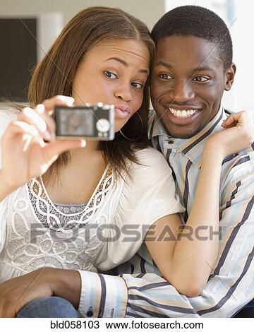African couple taking own photograph View Large Photo Image Stock Image - African couple taking own photograph. Fotosearch