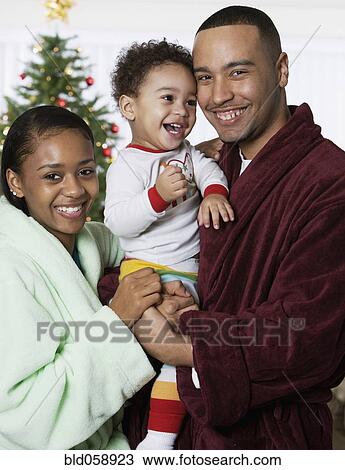 African family in front of Christmas tree View Large Photo Image Stock Image - African family in front of Christmas tree. Fotosearch