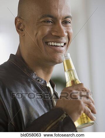 African man drinking beer View Large Photo Image Stock Image - African man drinking beer. Fotosearch