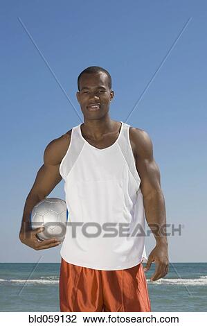 African man holding volleyball View Large Photo Image Stock Image - African man holding volleyball. Fotosearch