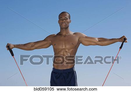 African man stretching with exercise band View Large Photo Image Stock Photography - African man stretching with exercise band. Fotosearch