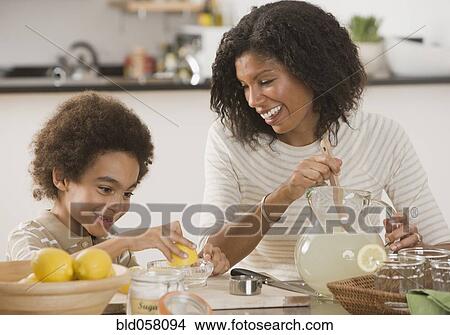 African mother and son making lemonade View Large Photo Image Picture - African mother and son making lemonade. Fotosearch