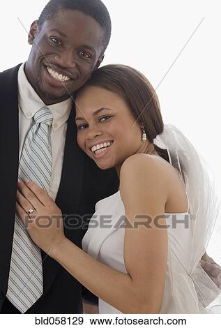 Stock Photo - African newlyweds hugging. Fotosearch
