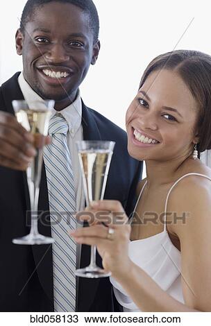 African newlyweds toasting with champagne View Large Photo Image Stock Image - African newlyweds toasting with champagne. Fotosearch