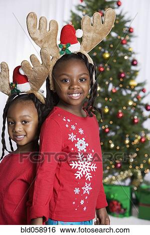 African sisters wearing reindeer antlers View Large Photo Image Stock Photograph - African sisters wearing reindeer antlers. Fotosearch