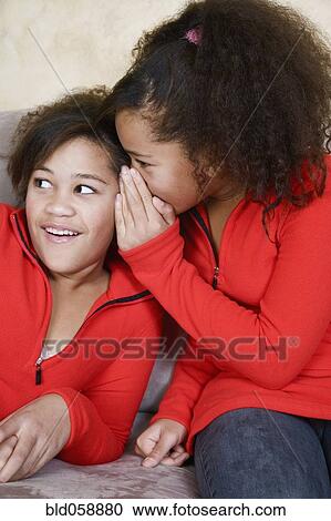 African twin sisters telling secret View Large Photo Image Stock Image - African twin sisters telling secret. Fotosearch
