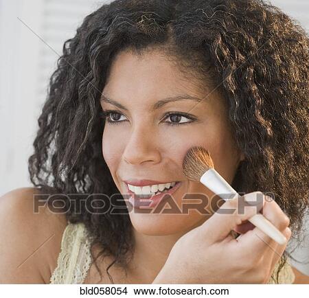 African woman applying makeup View Large Photo Image Picture - African woman applying makeup. Fotosearch