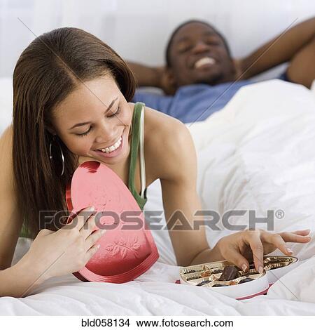 African woman eating valentine’s day chocolate View Large Photo Image Picture - African woman eating valentine’s day chocolate. Fotosearch