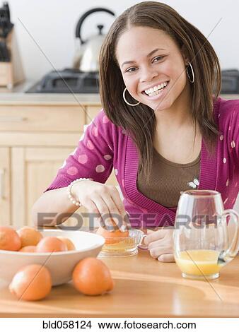 African woman juicing oranges View Large Photo Image Picture - African woman juicing oranges. Fotosearch