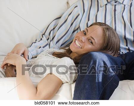 African woman laying on boyfriend's lap View Large Photo Image Stock Image - African woman laying on boyfriend's lap. Fotosearch