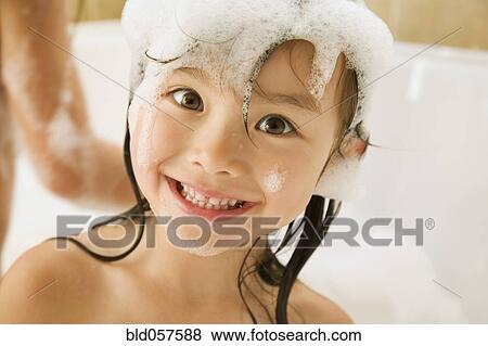 Asian girl in bubble bath View Large Photo Image Stock Photo - Asian girl in bubble bath. Fotosearch
