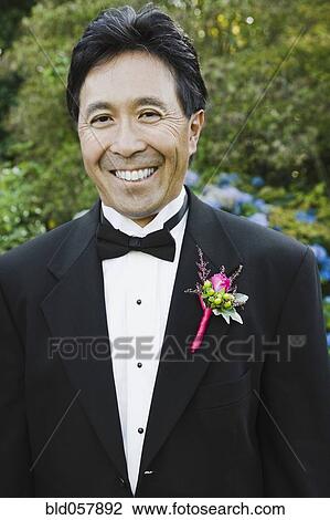 Asian man with boutonniere on lapel View Large Photo Image Stock Image - Asian man with boutonniere on lapel. Fotosearch
