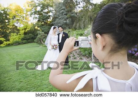 Asian newlyweds having photograph taken View Large Photo Image Stock Image - Asian newlyweds having photograph taken. Fotosearch