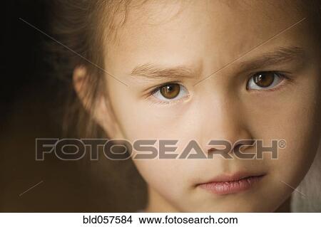 Close up of Asian girl with furrowed brow View Large Photo Image Picture - Close up of Asian girl with furrowed brow. Fotosearch