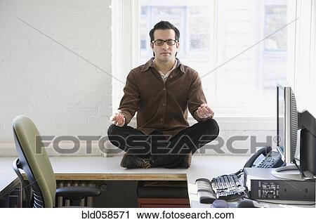 Hispanic businessman meditating View Large Photo Image Stock Image - Hispanic businessman meditating. Fotosearch