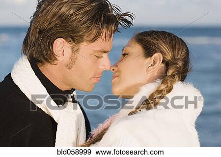 Hispanic couple about to kiss View Large Photo Image Stock Photo - Hispanic couple about to kiss. Fotosearch