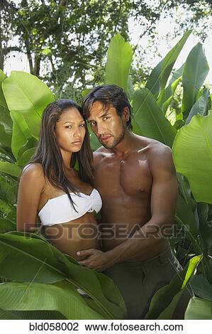 Stock Image - Hispanic couple hugging. Fotosearch