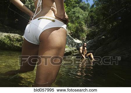 Stock Photography - Hispanic couple in water. Fotosearch