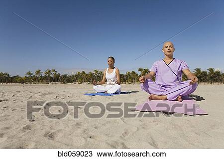 Hispanic couple meditating View Large Photo Image Stock Image - Hispanic couple meditating. Fotosearch
