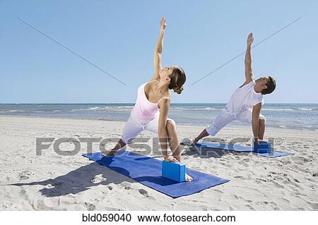 Hispanic couple practicing yoga View Large Photo Image Stock Image - Hispanic couple practicing yoga. Fotosearch