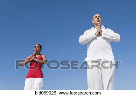 Hispanic couple practicing yoga View Large Photo Image Stock Photograph - Hispanic couple practicing yoga. Fotosearch