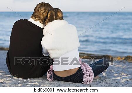 Hispanic couple sitting on beach View Large Photo Image Stock Image - Hispanic couple sitting on beach. Fotosearch