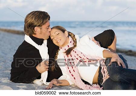 Hispanic couple sitting on beach View Large Photo Image Stock Image - Hispanic couple sitting on beach. Fotosearch