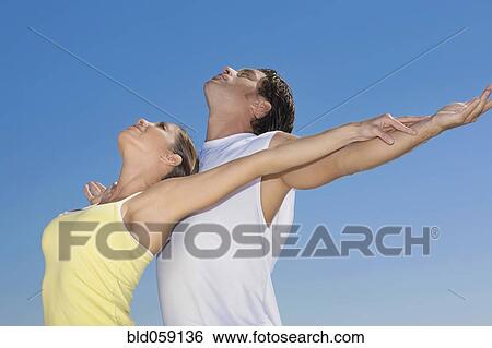 Hispanic couple stretching View Large Photo Image Stock Photograph - Hispanic couple stretching. Fotosearch