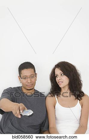 Hispanic couple watching television View Large Photo Image Stock Image - Hispanic couple watching television. Fotosearch