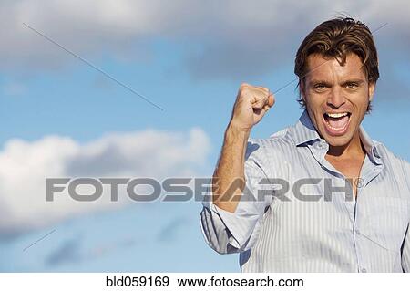 Hispanic man cheering View Large Photo Image Stock Photo - Hispanic man cheering. Fotosearch