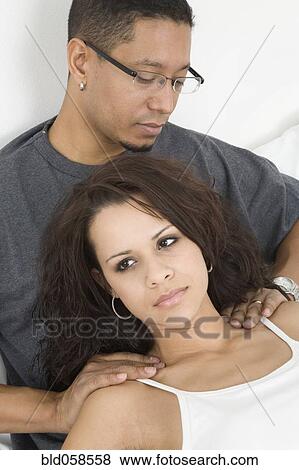 Hispanic man massaging wife’s shoulders View Large Photo Image Stock Photo - Hispanic man massaging wife’s shoulders. Fotosearch