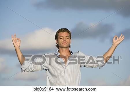 Hispanic man meditating View Large Photo Image Picture - Hispanic man meditating. Fotosearch