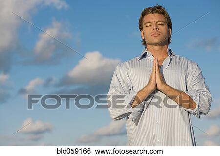 Hispanic man meditating View Large Photo Image Stock Photograph - Hispanic man meditating. Fotosearch