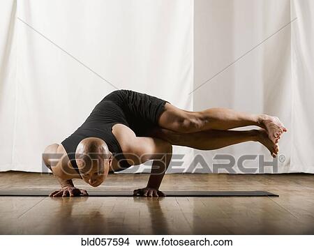 Hispanic man practicing yoga View Large Photo Image Picture - Hispanic man practicing yoga. Fotosearch
