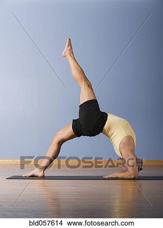 Hispanic man practicing yoga View Large Photo Image Picture - Hispanic man practicing yoga. Fotosearch
