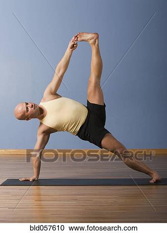 Hispanic man practicing yoga View Large Photo Image Stock Image - Hispanic man practicing yoga. Fotosearch
