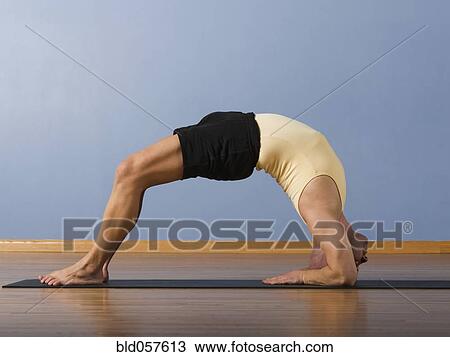 Hispanic man practicing yoga View Large Photo Image Stock Image - Hispanic man practicing yoga. Fotosearch