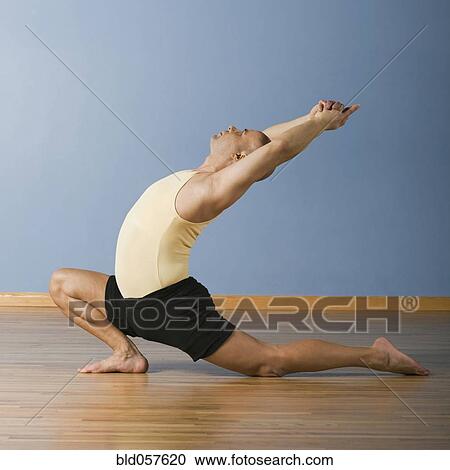 Hispanic man practicing yoga View Large Photo Image Stock Image - Hispanic man practicing yoga. Fotosearch