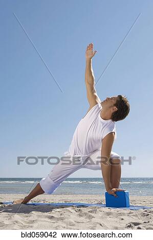 Hispanic man practicing yoga View Large Photo Image Stock Image - Hispanic man practicing yoga. Fotosearch